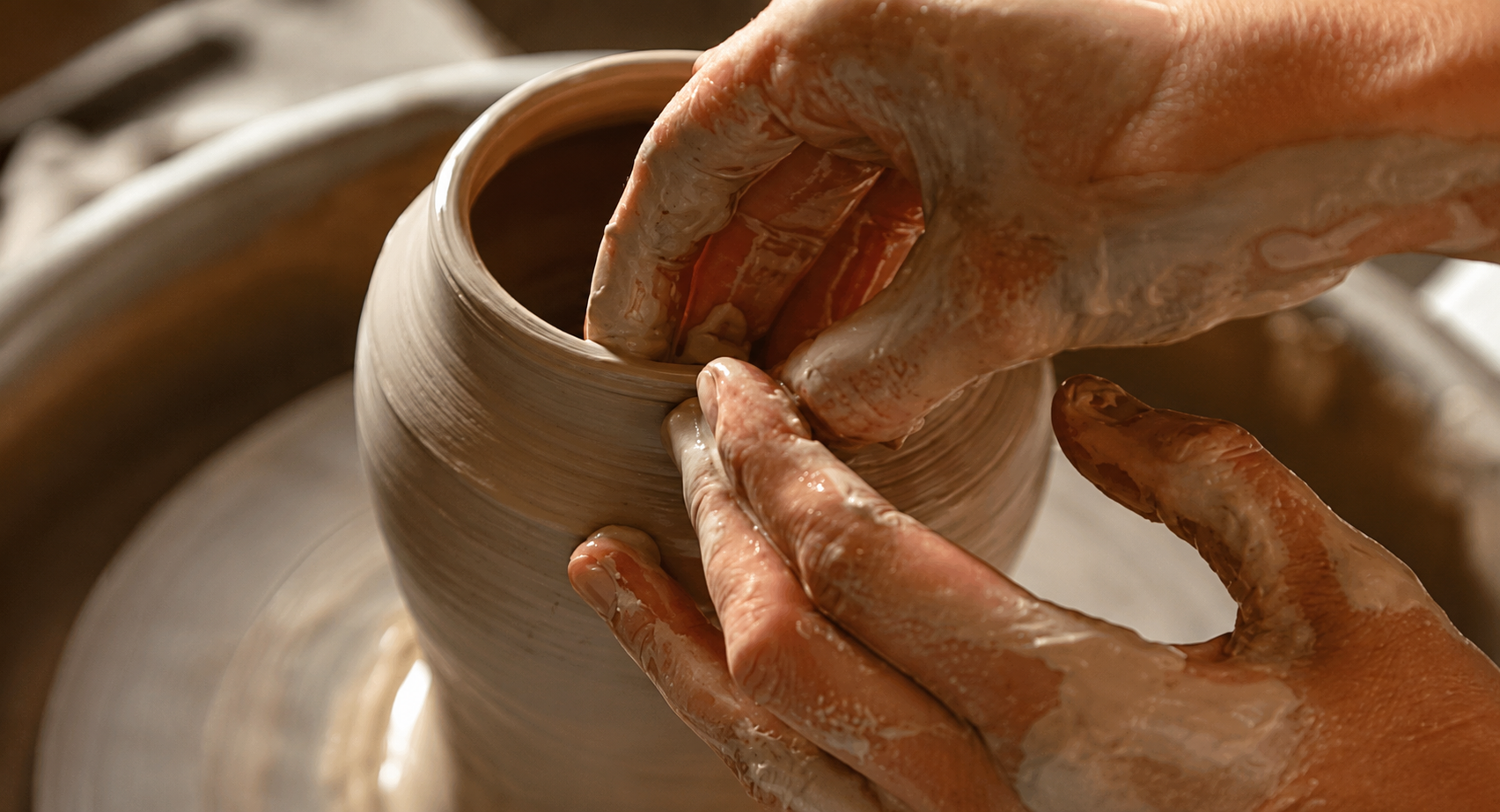 Crafting pottery on a wheel